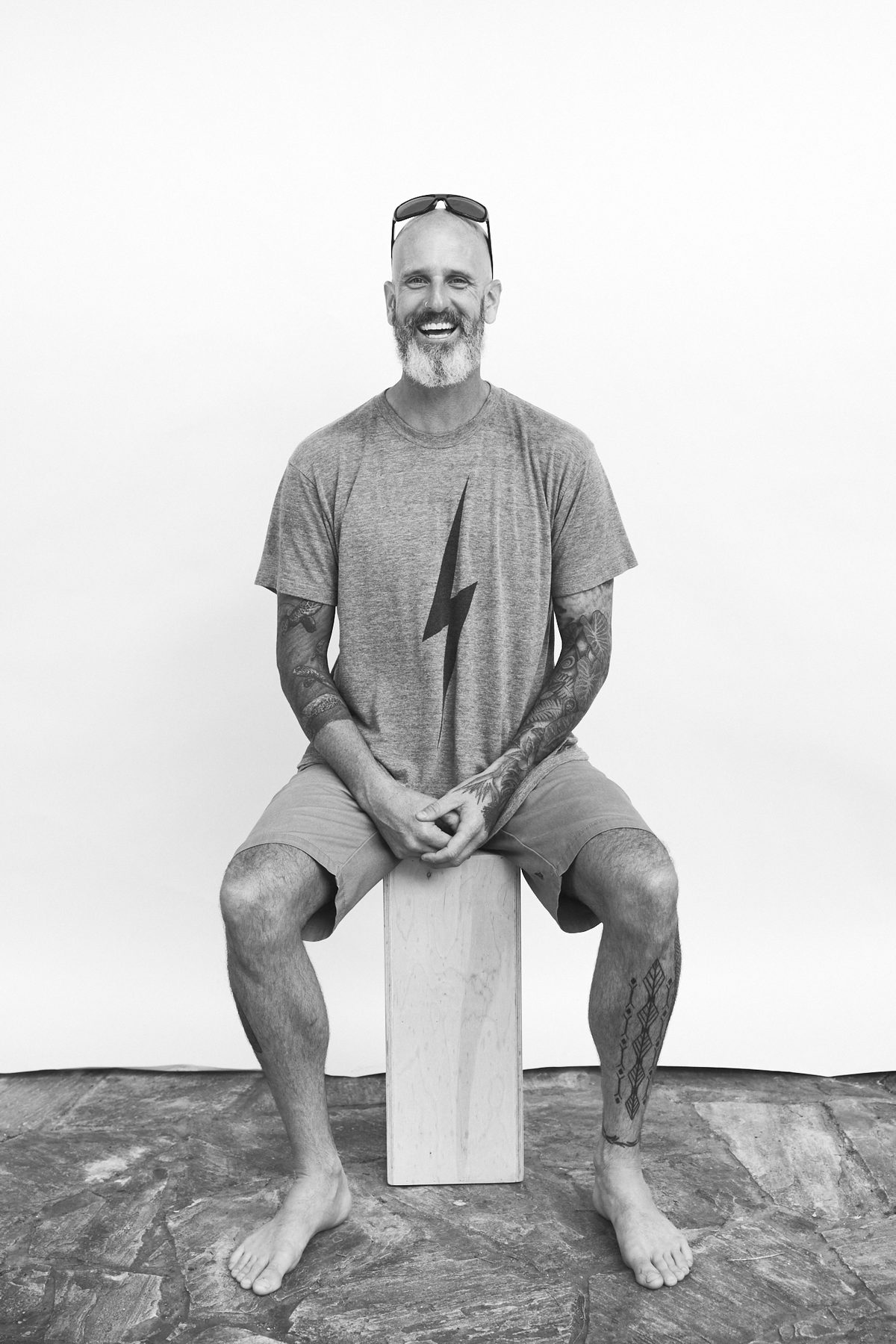 Studio black and white portrait of surf photographer Tommy Pierucki.